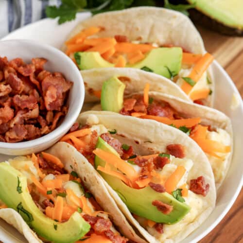 breakfast tacos arranged on a plate