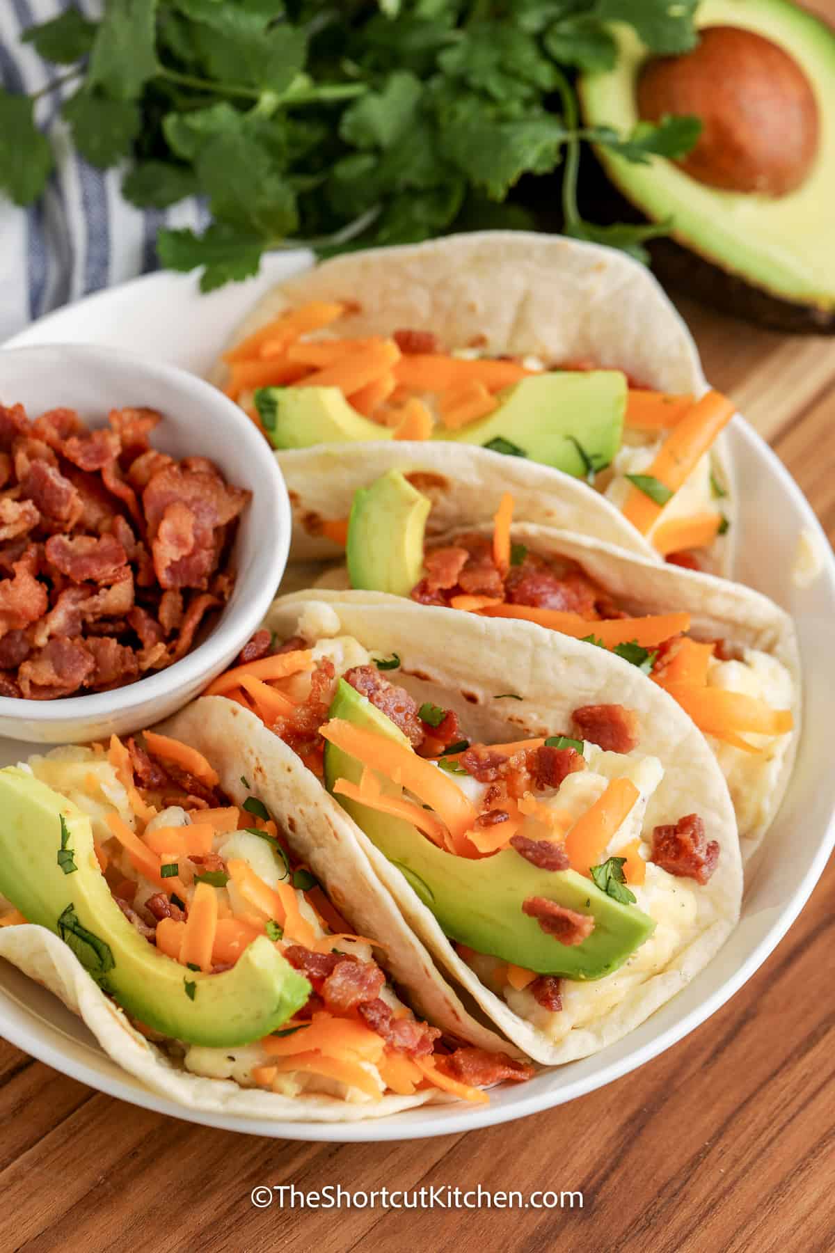 breakfast tacos arranged on a plate