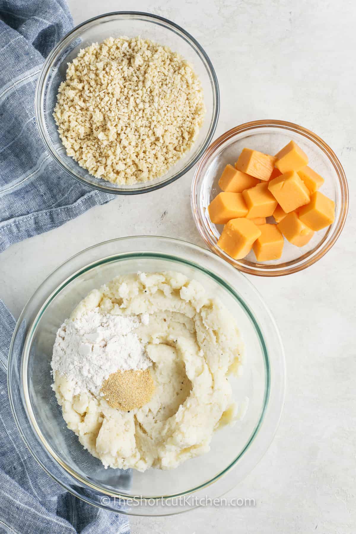 mixing ingredients together to make Fried Mashed Potato Balls