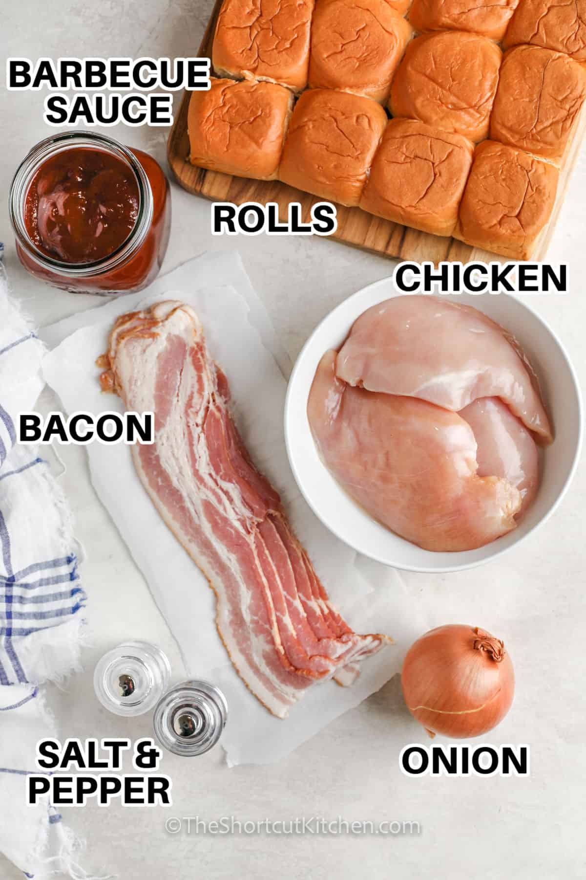 barbecue sauce , rolls, chicken , bacon , onion and seasonings with labels to make BBQ Bacon Chicken Sliders