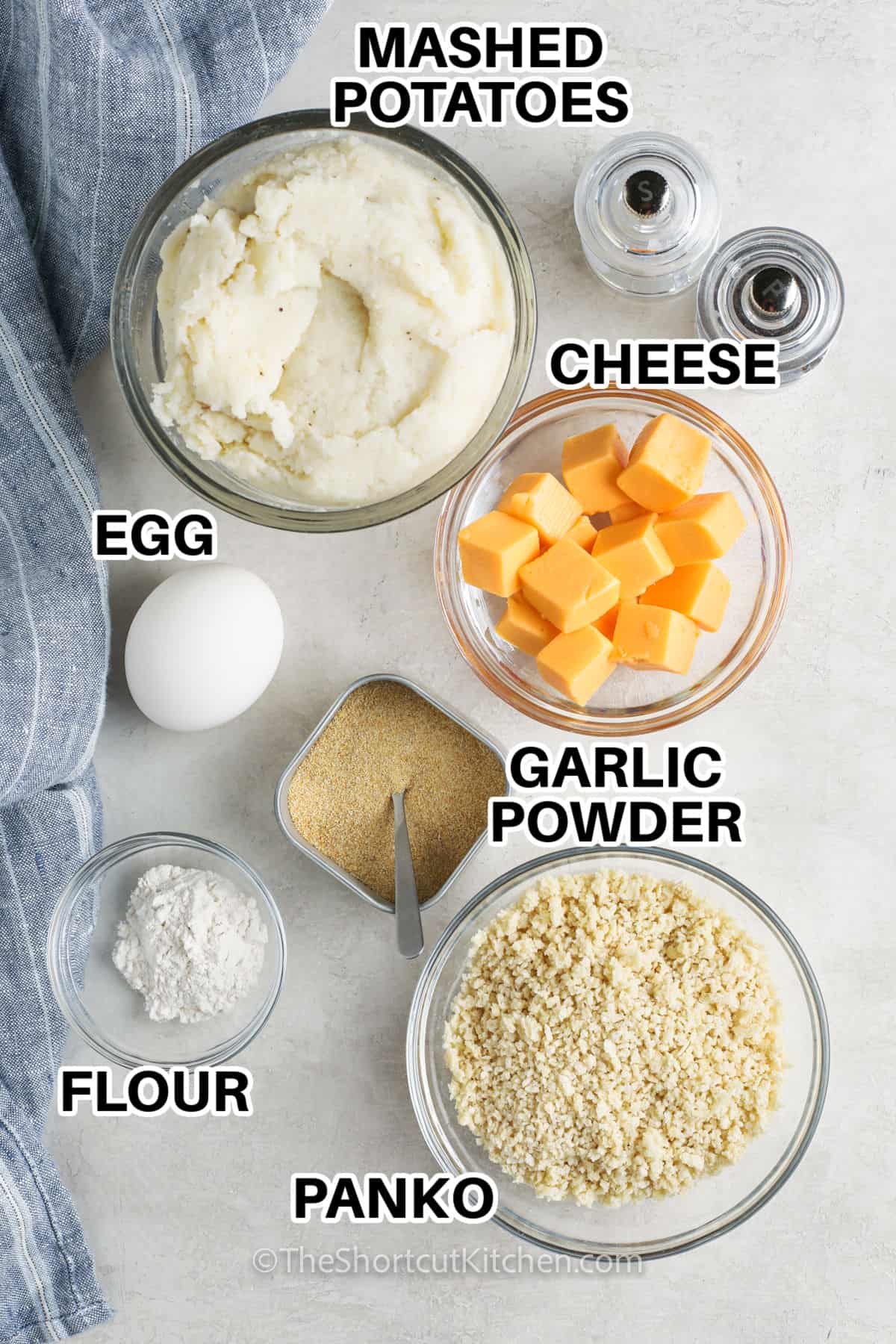 mashed potatoes , cheese , egg , garlic powder , panko and flour with labels to make Fried Mashed Potato Balls