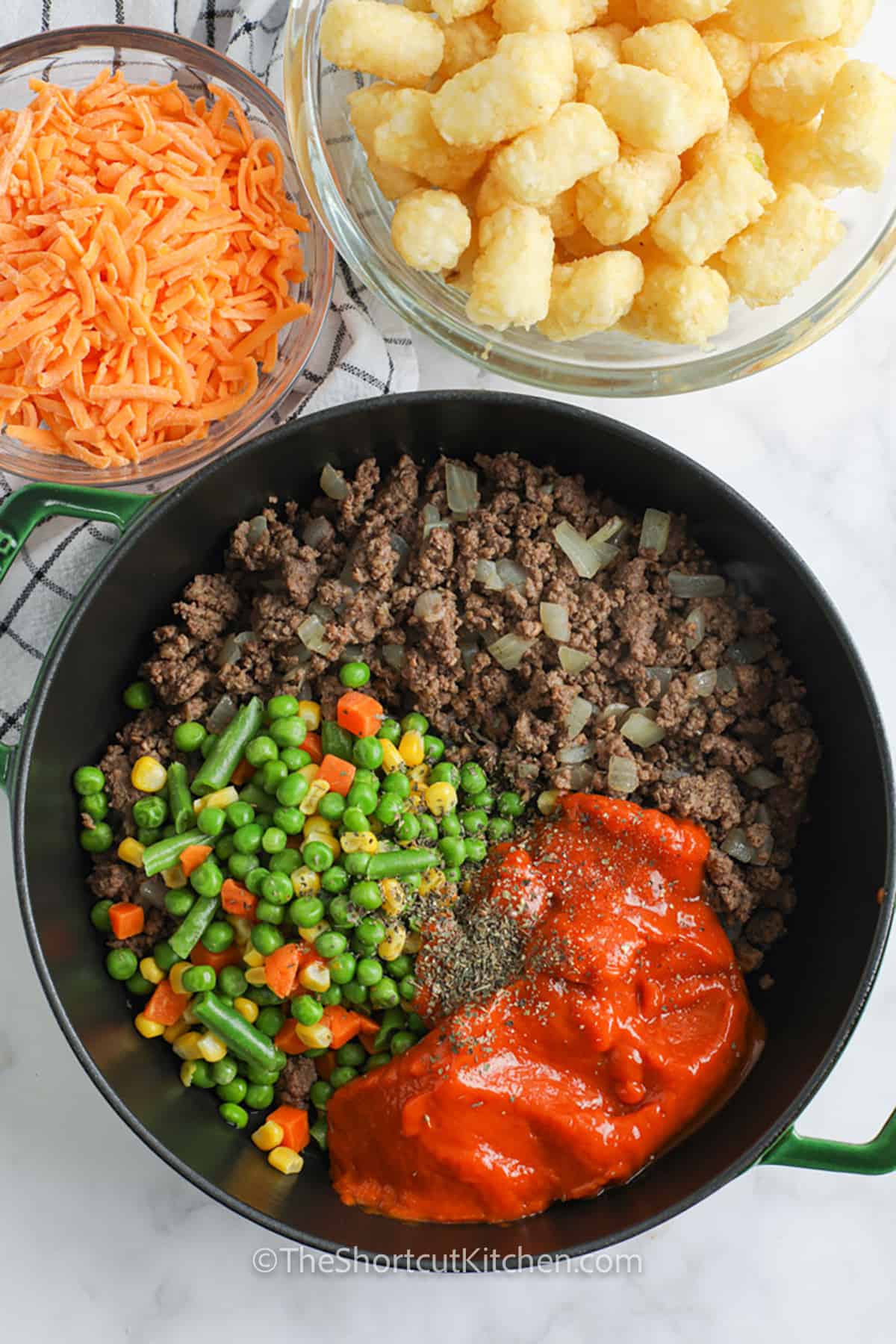 adding ingredients to pan to make Shortcut Shepherd’s Pie