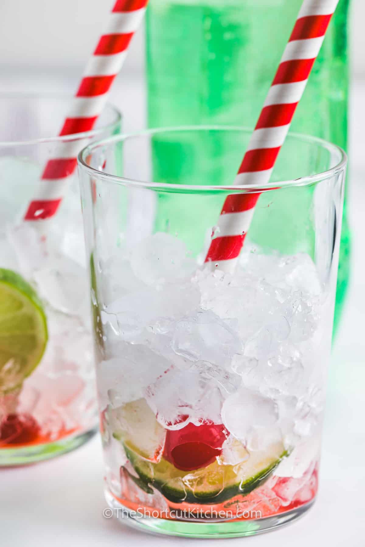 ice , cherries , cherry juice and lime in a glass to make Copycat Sonic Cherry Limeade Recipe