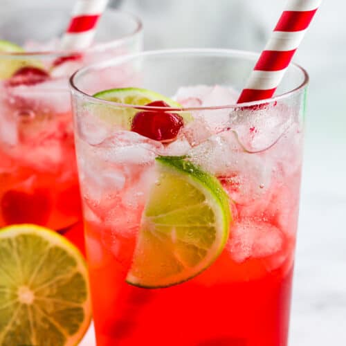 Copycat Sonic Cherry Limeade Recipe in glasses with lime slices and cherries