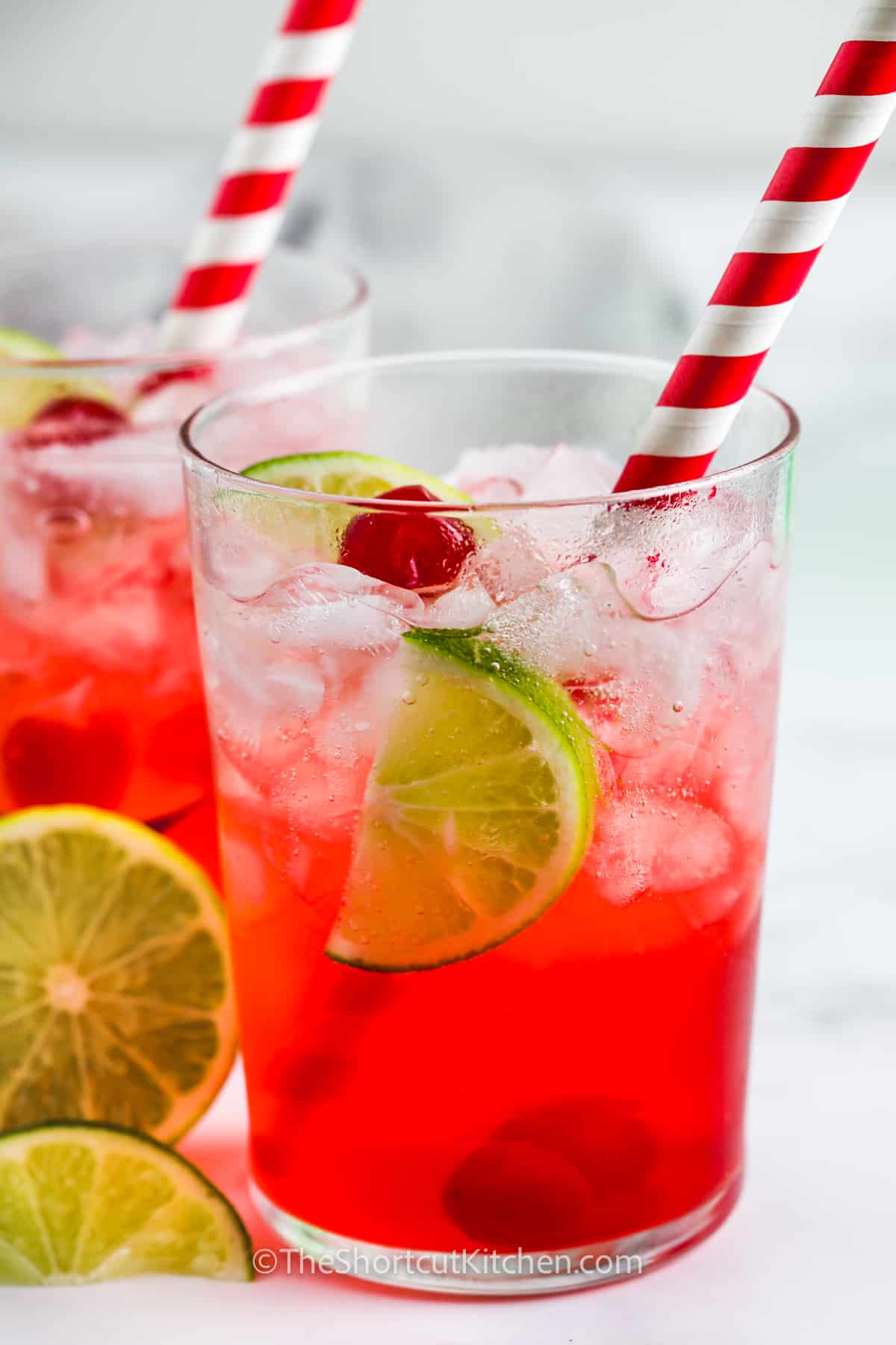 Copycat Sonic Cherry Limeade Recipe in glasses with lime slices and cherries