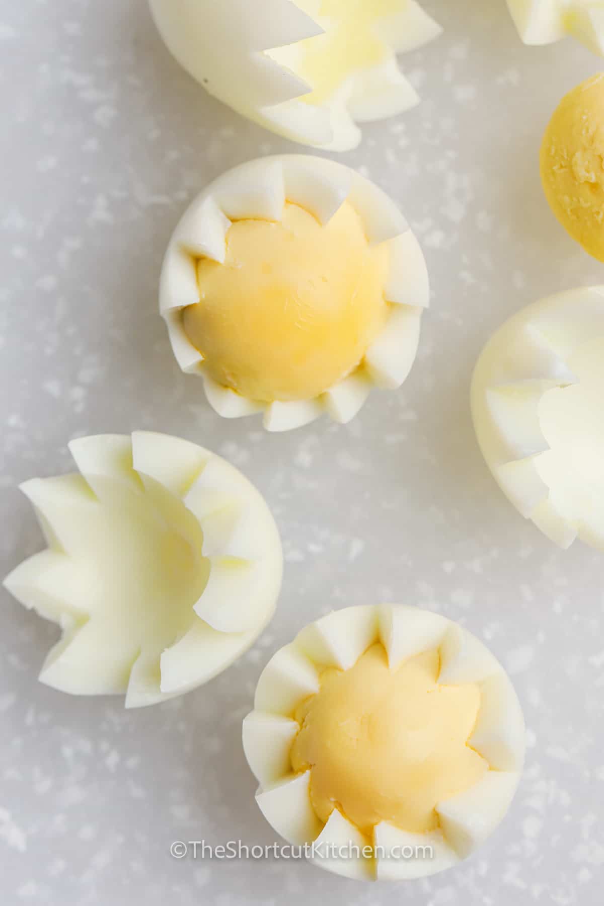 cutting eggs to make Deviled Egg Chicks