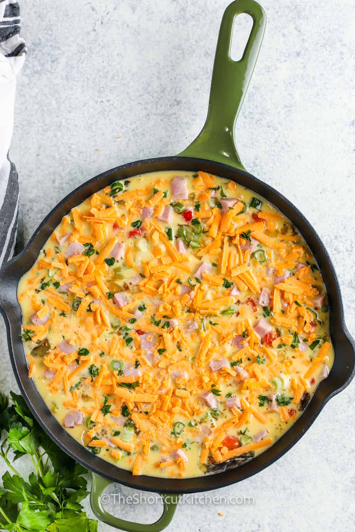 adding cheese to an Easy Egg Frittata Recipe