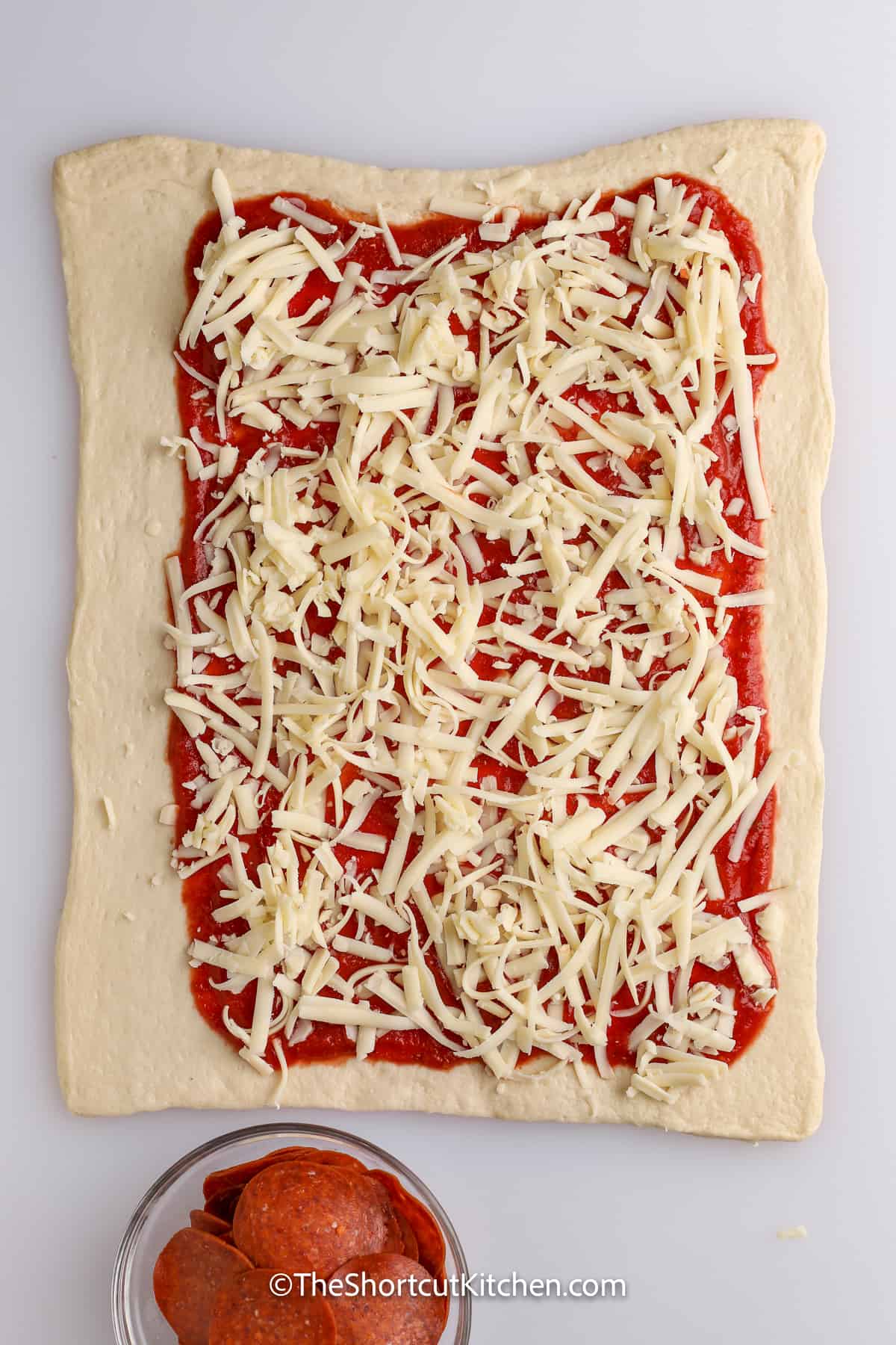 cheese added to pizza dough