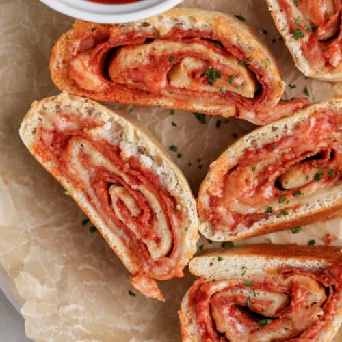 pizza roll up sliced on a plate