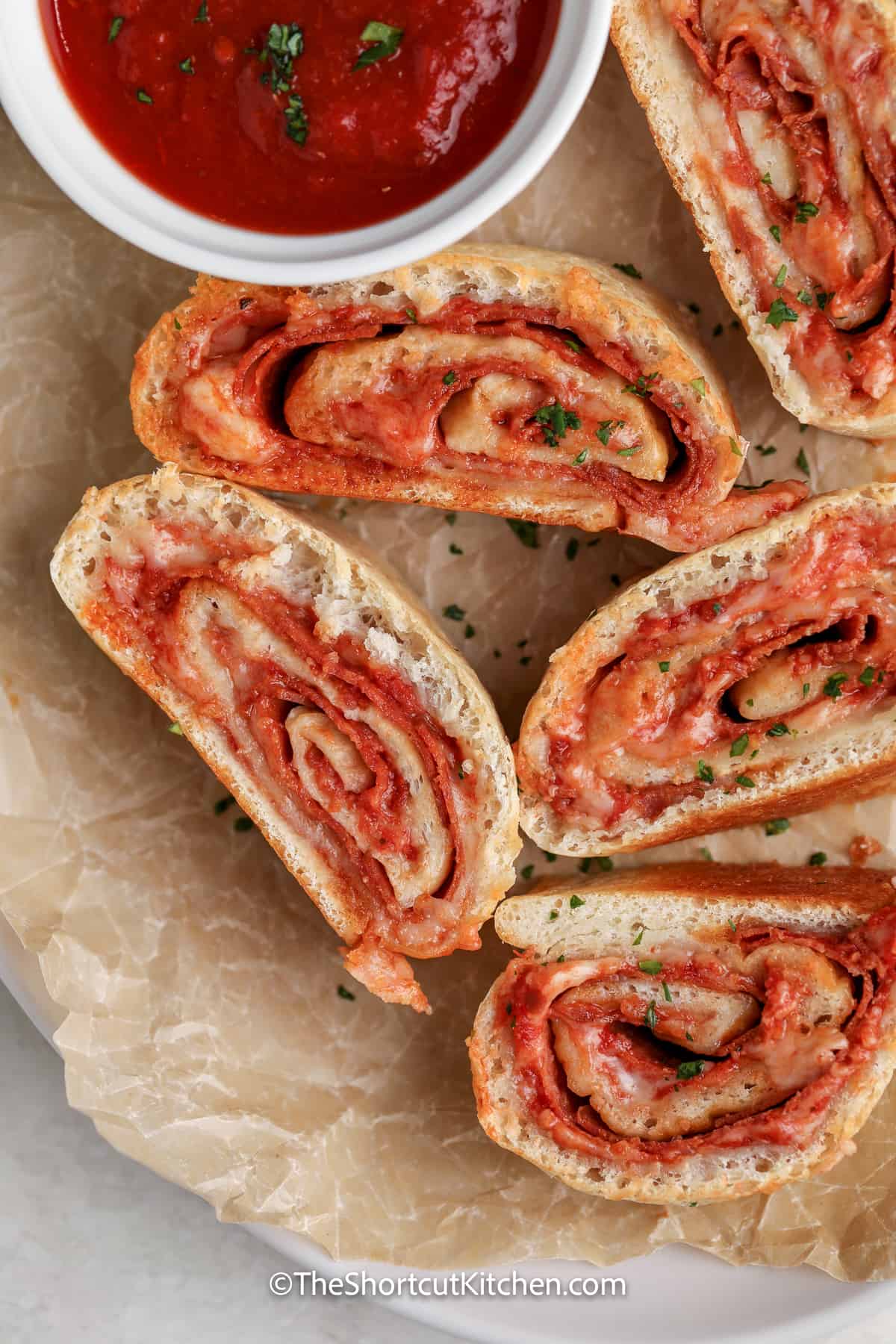 pizza roll up sliced on a plate