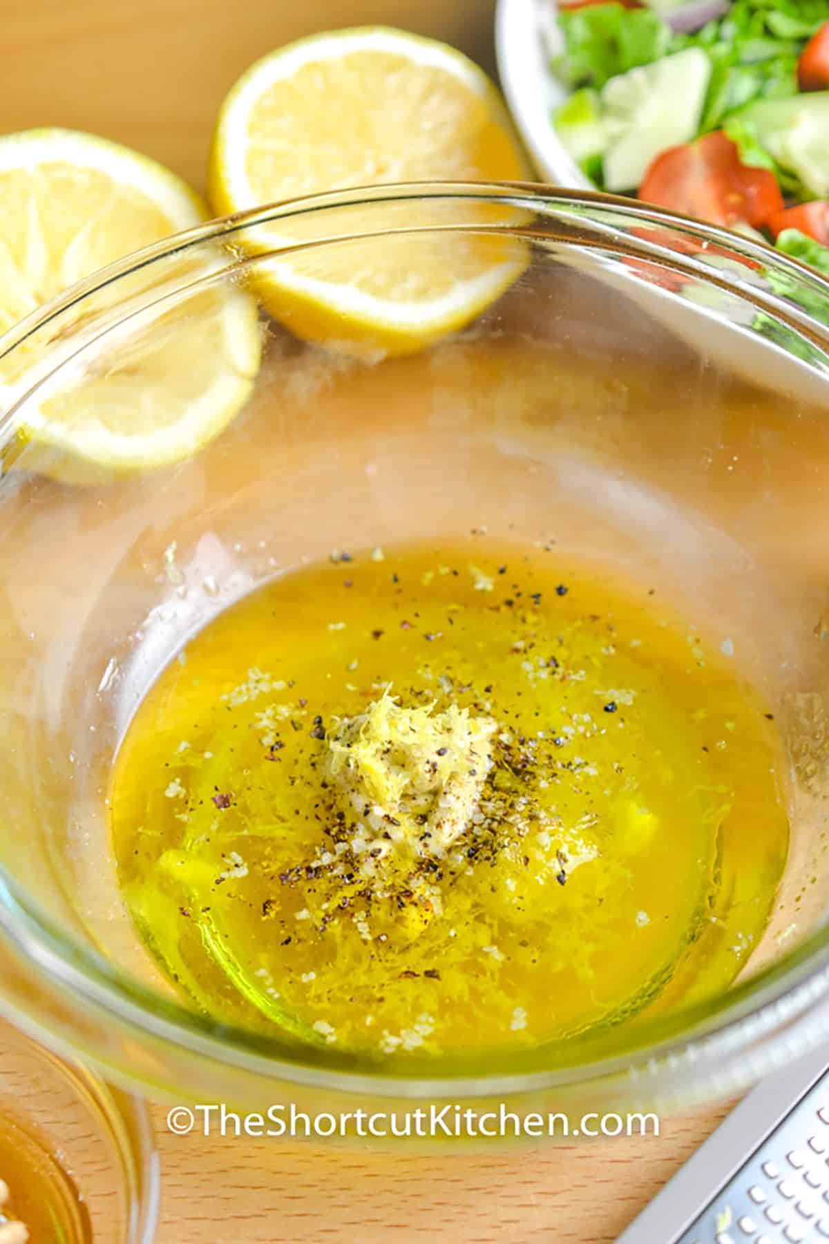 adding ingredients together to make Lemon Vinaigrette