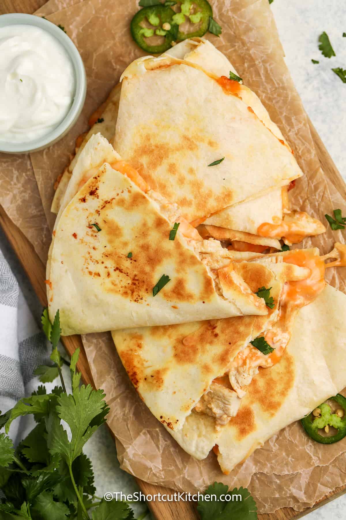 copycat taco bell chicken quesadillas sliced on a cutting board