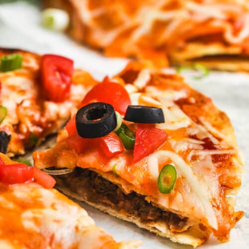 close up of Copycat Taco Bell Mexican Pizza with a piece taken out