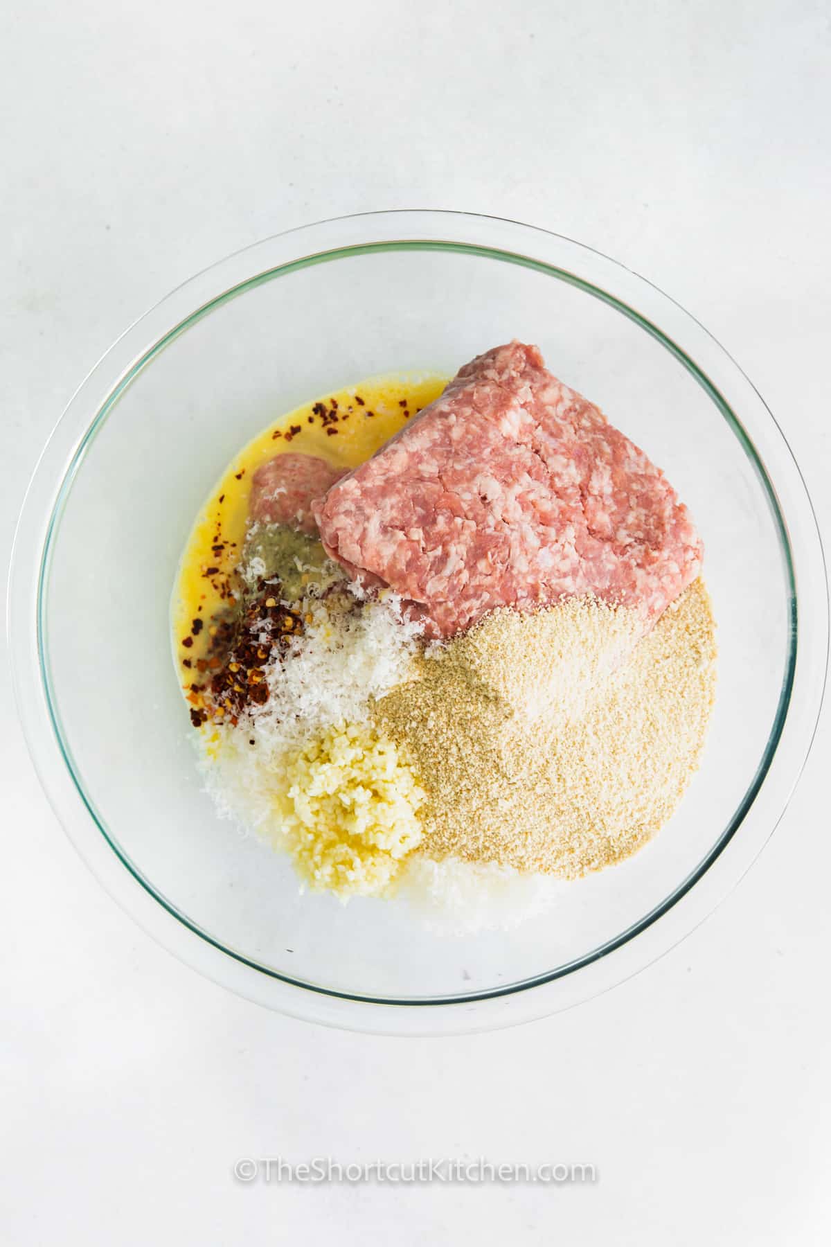 ingredients in a bowl to make Easy Air Fryer Meatballs
