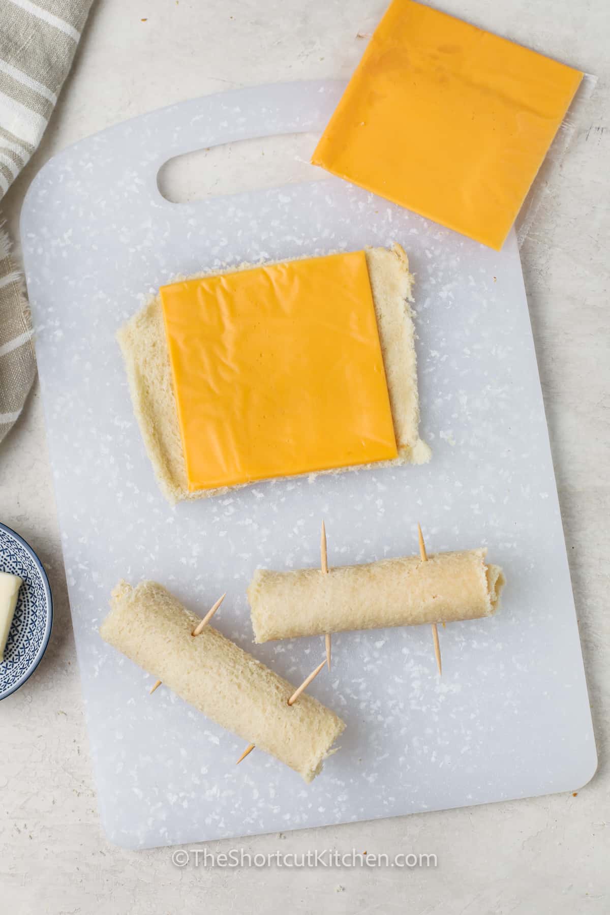 rolling up Grilled Cheese Roll Ups