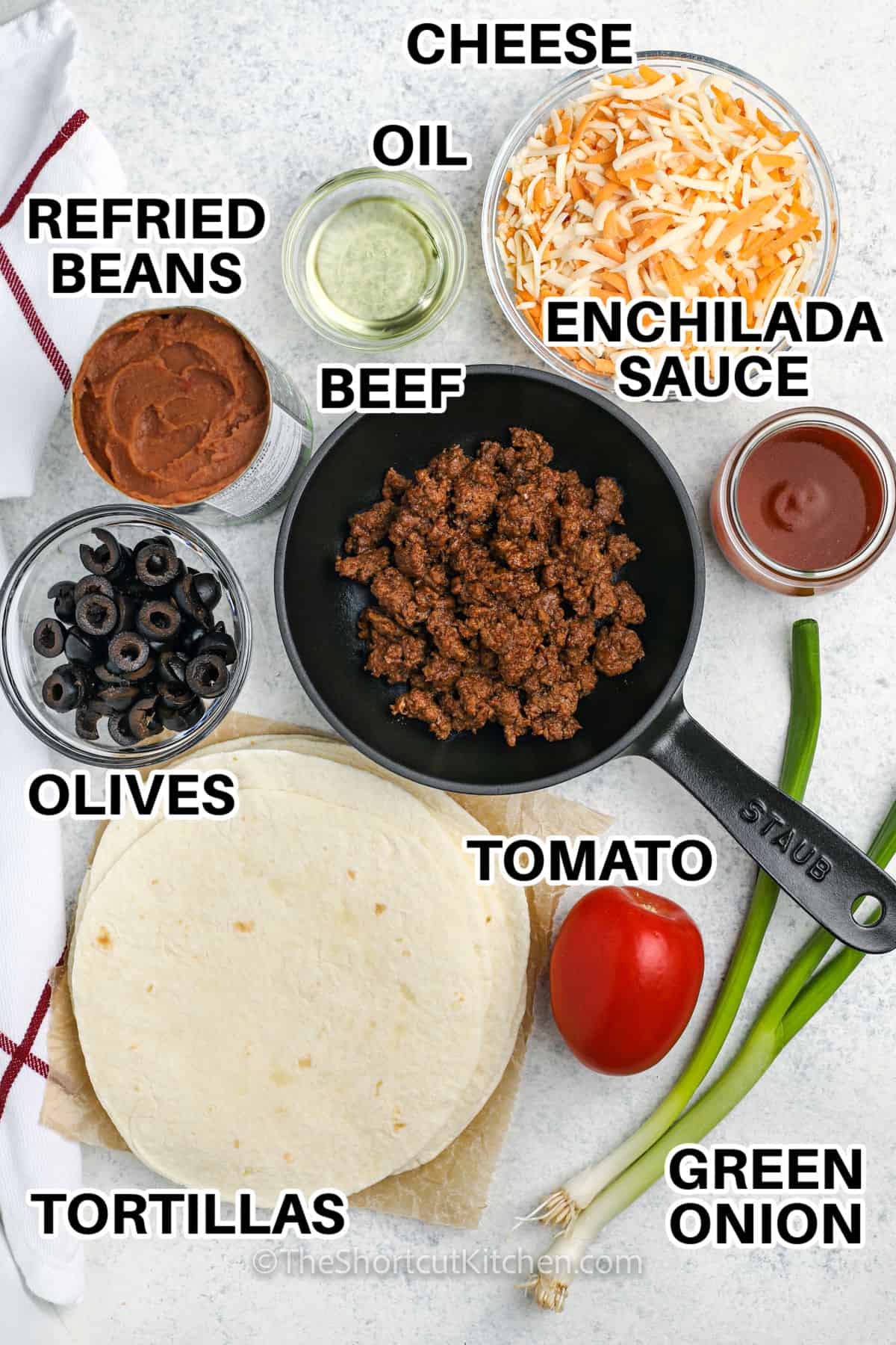 cheese , oil , enchilada sauce , beef , refried beans , olives , tomato , green onion and tortillas with labels to make Copycat Taco Bell Mexican Pizza