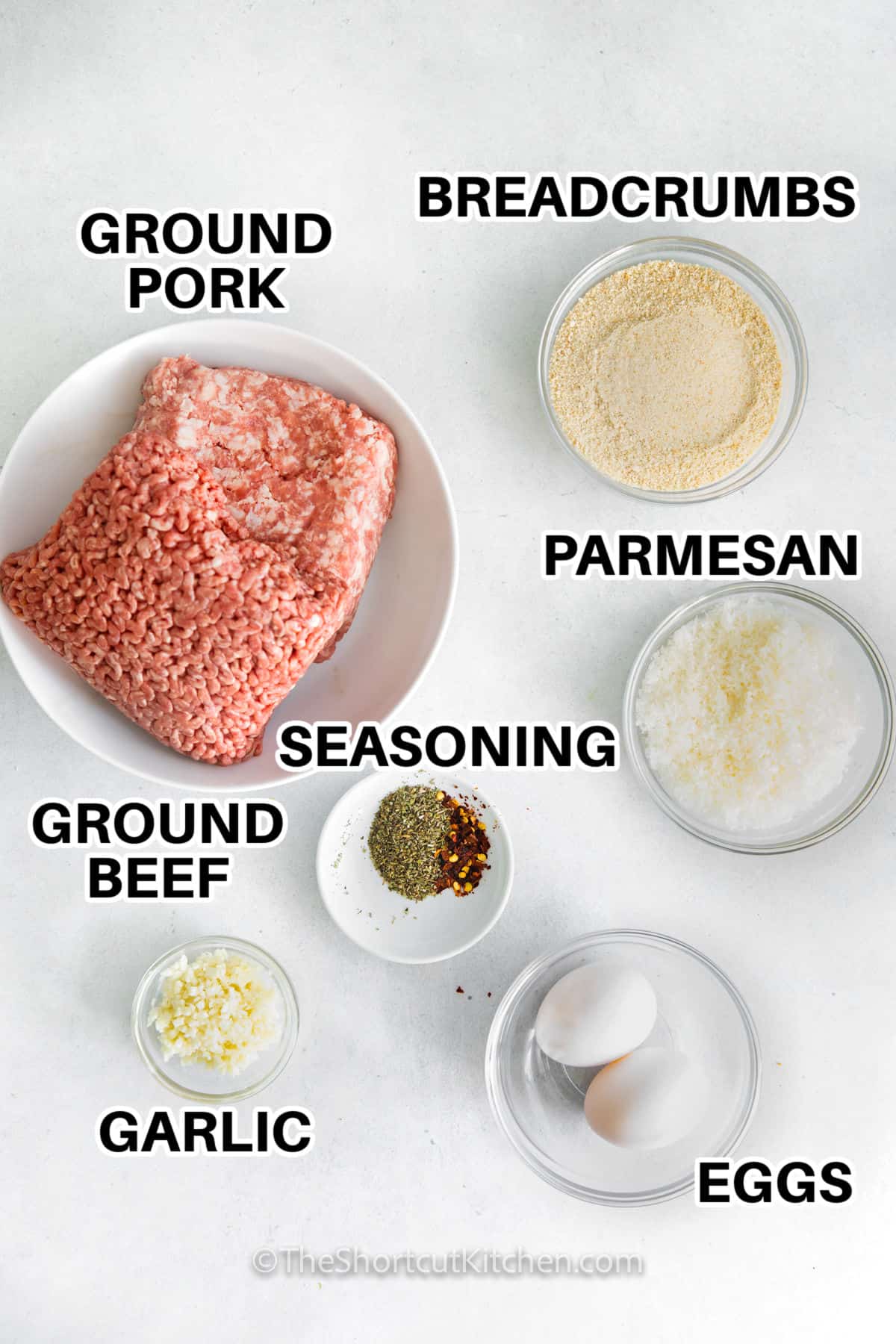 ground pork , ground beef , seasoning , garlic , eggs , parmesan and breadcrumbs with labels to make Easy Air Fryer Meatballs