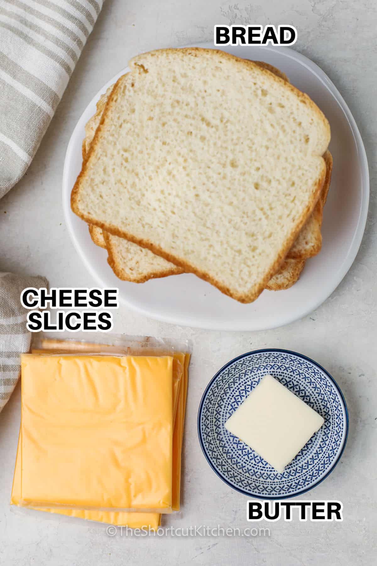 bread , cheese slices , butter with labels to make Grilled Cheese Roll Ups