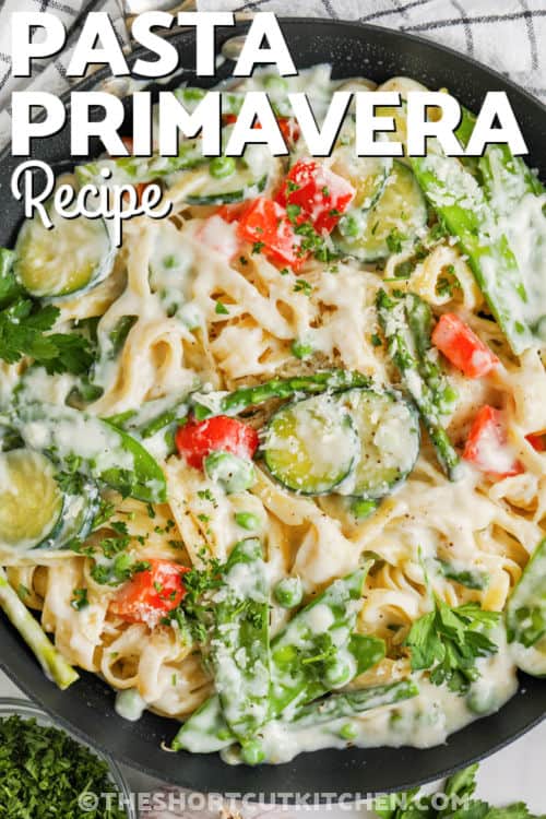 cooked Pasta Primavera in the pan with writing