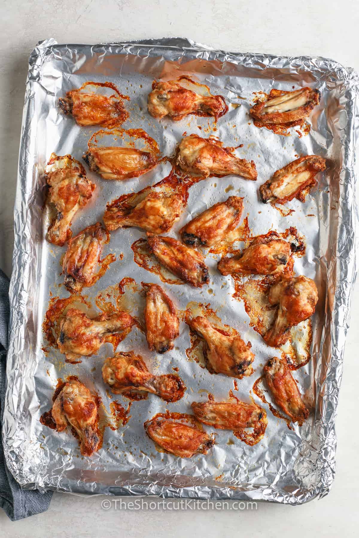 cooked chicken on a sheet pan to make Oven Baked Chicken Wings
