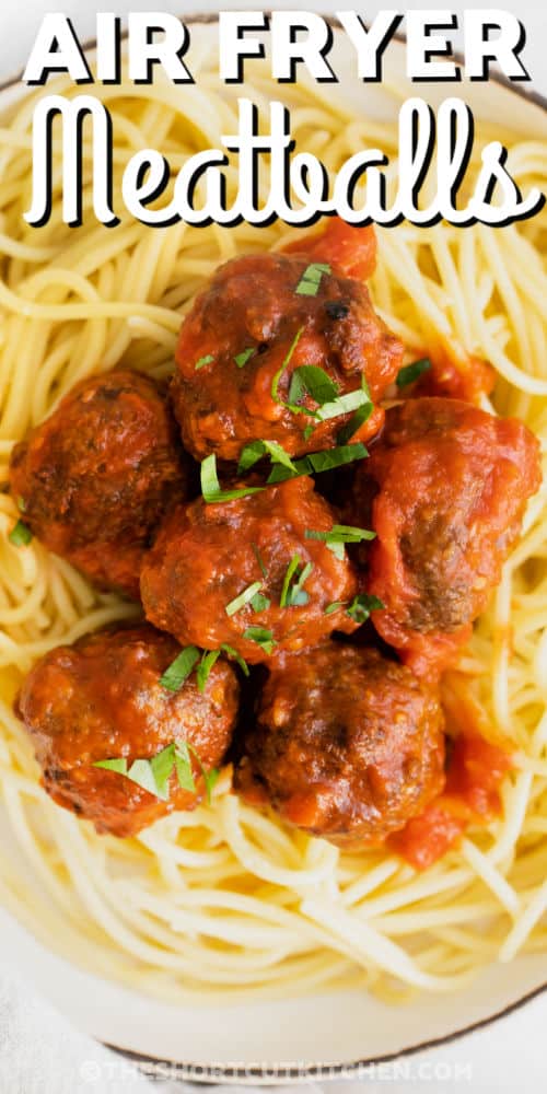 close up of Easy Air Fryer Meatballs on spaghetti with writing