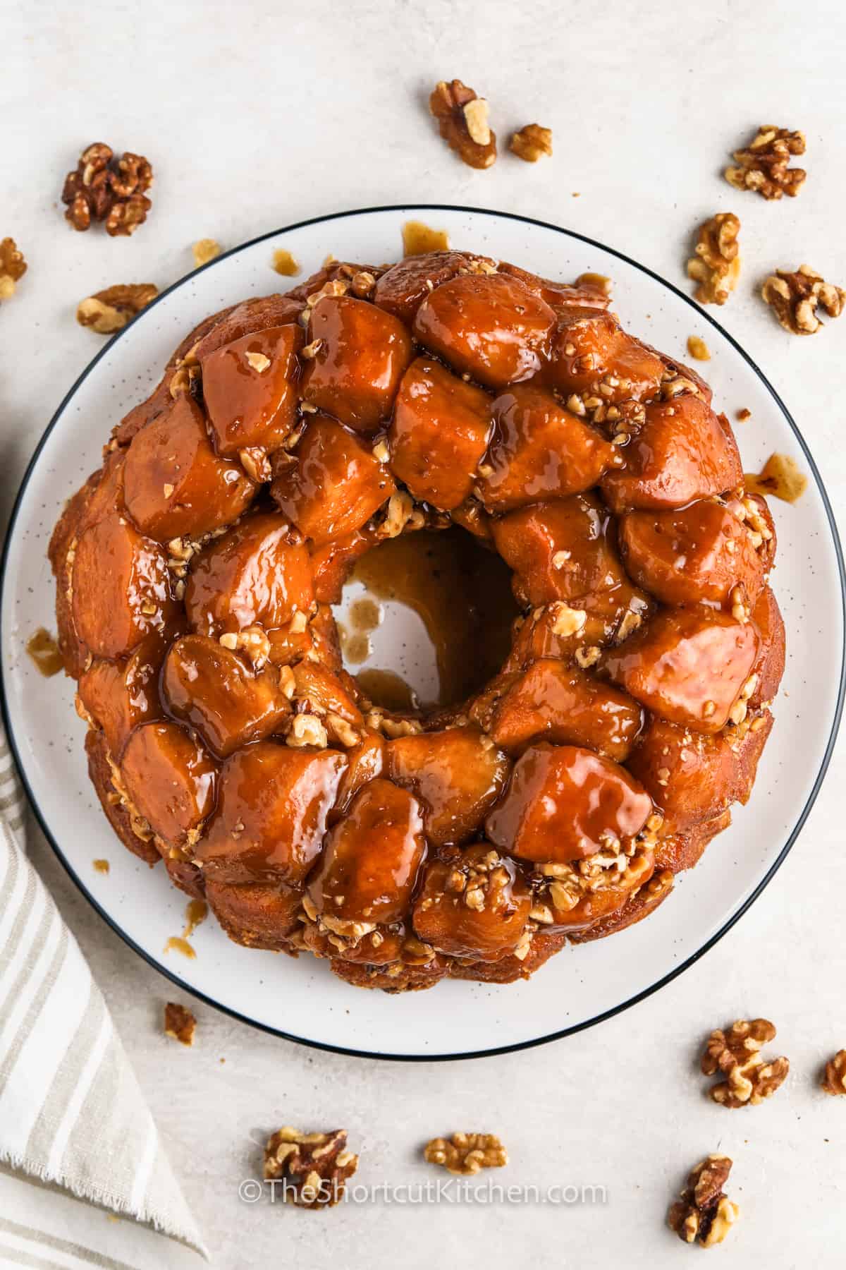 Easy monkey bread brings a gooey cinnamon sugar mix together with buttery caramel flavor to make a sweet pull apart loaf that is perfect for breakfast, brunch, or any holiday gathering. It is a no fuss way to serve something warm and sweet that the whole family can enjoy. Each piece pulls away easily and carries plenty of comforting flavor, making it a great dish for sharing. #theshortcutkitchen plated recipe for Monkey Bread