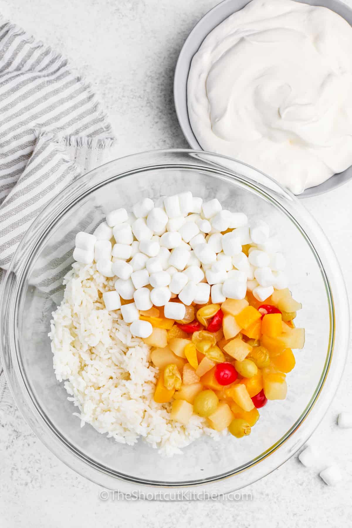 adding ingredients to bowl to make Glorified Rice