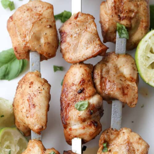 Skewered lime grilled chicken kabobs with lime and cilantro.