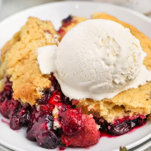close up of Mixed Berry Dump Cake with ice cream