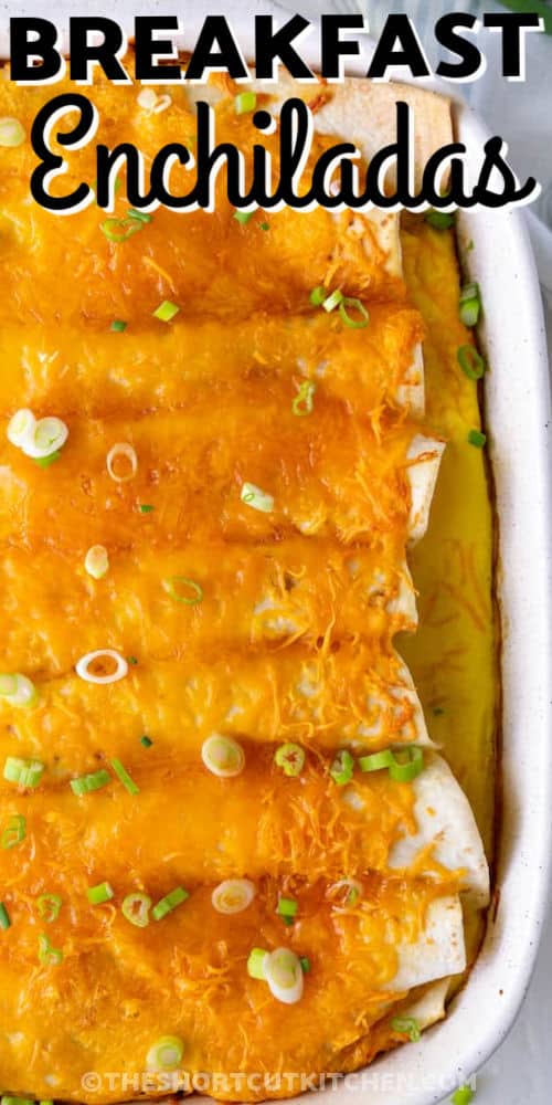 cheesy breakfast enchiladas recipe in a white baking dish with writing