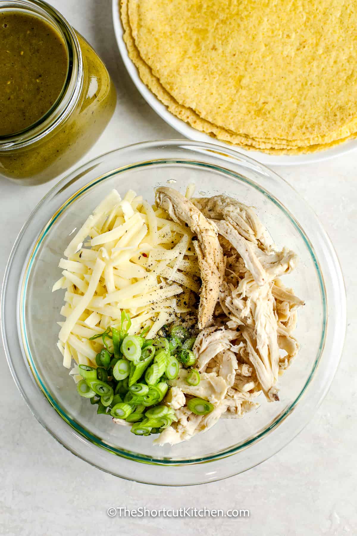 ingredients for easy chicken enchiladas filling in a bowl