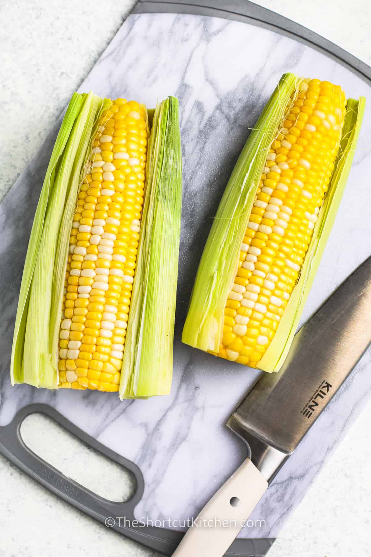opening corn to make Microwave Corn On The Cob