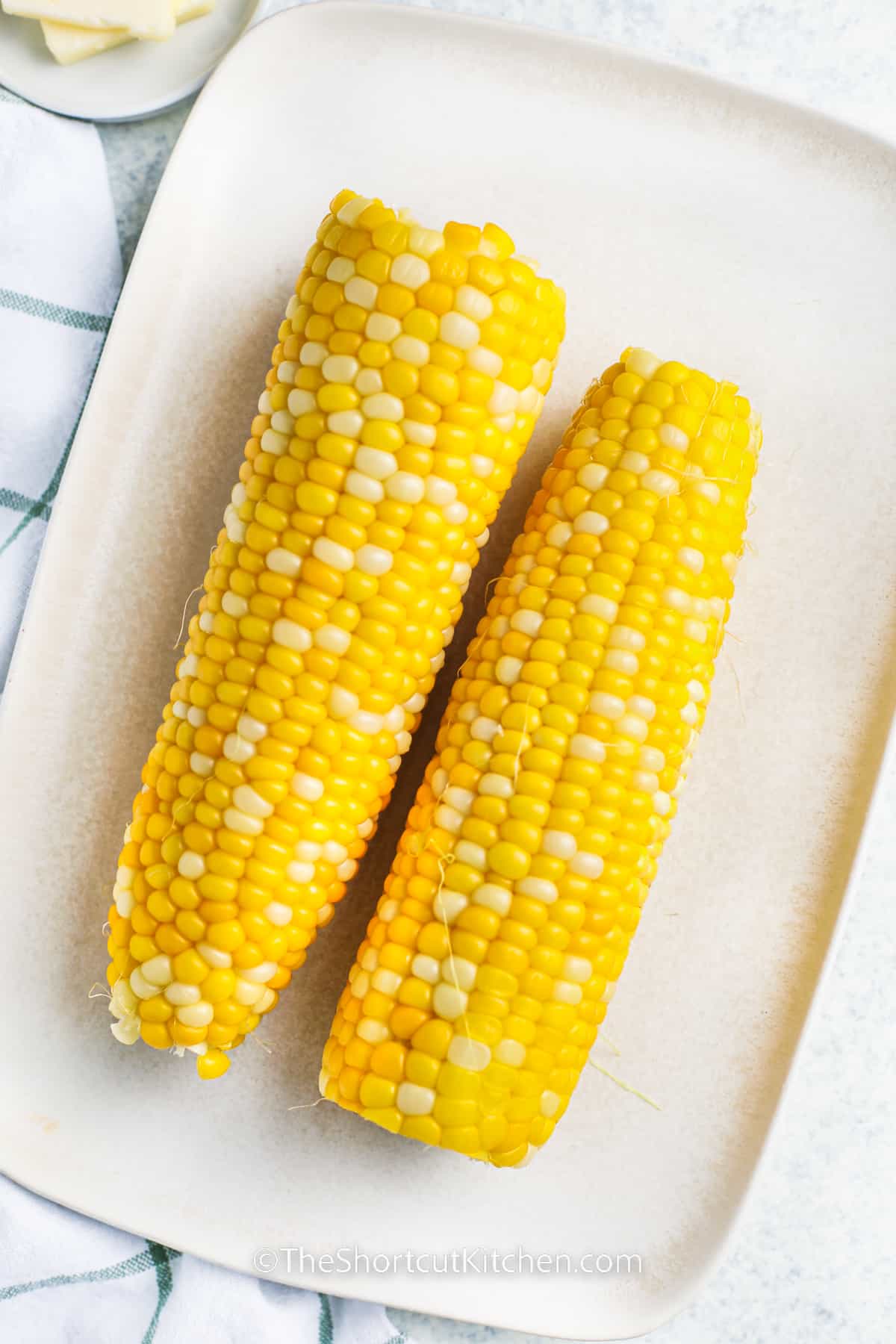 Microwave Corn On The Cob on a plate