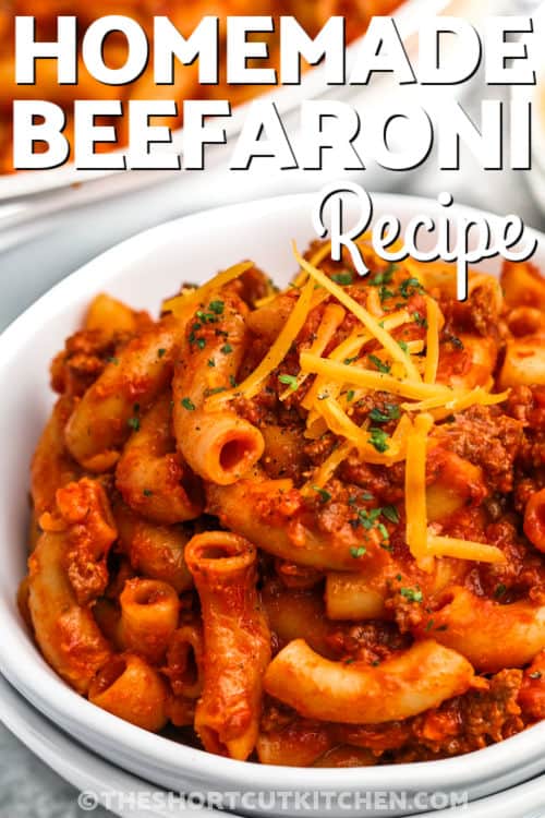 close up of plated Homemade Beefaroni Recipe with cheese and a title