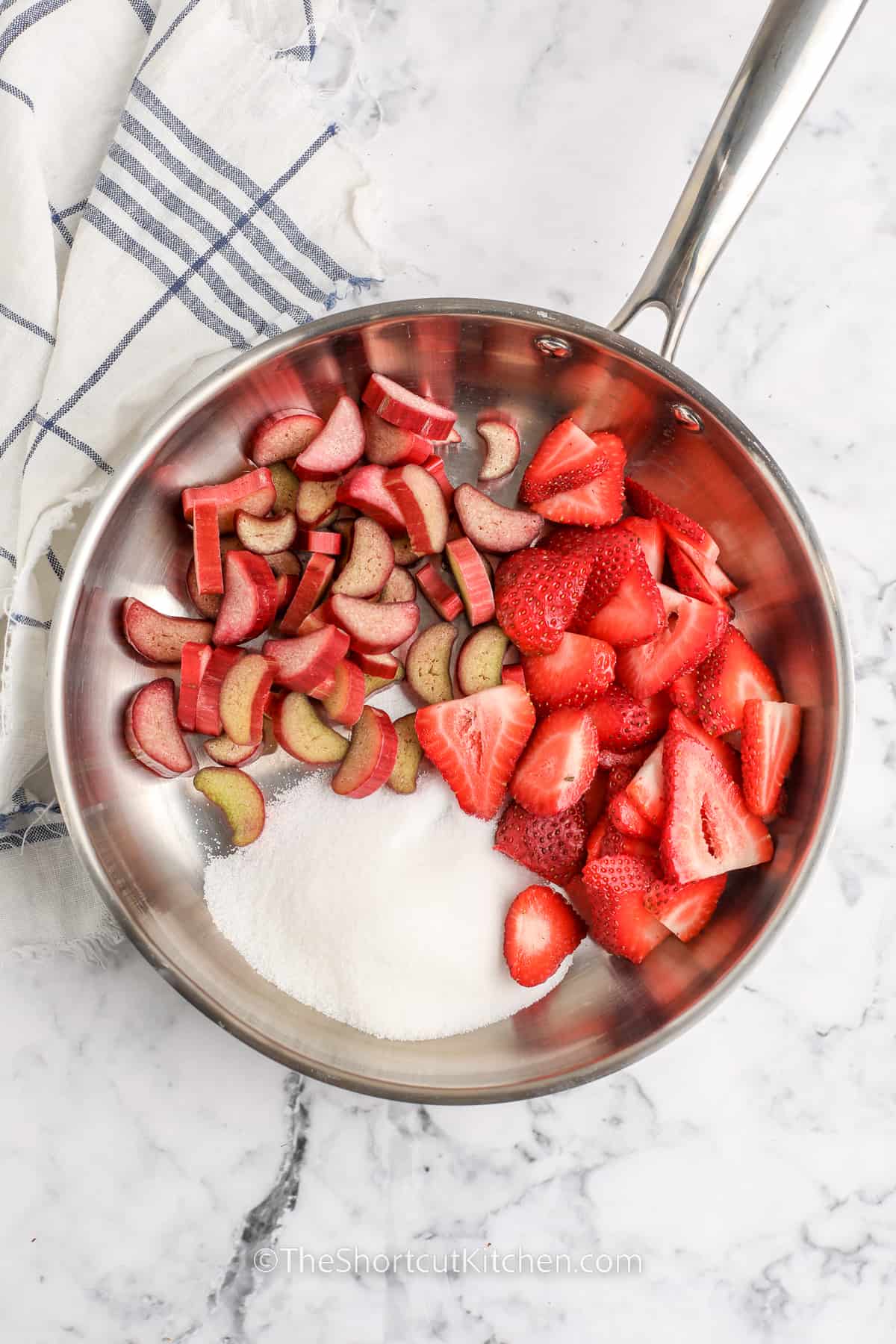ingredients in pan to make Strawberry Rhubarb Cobbler
