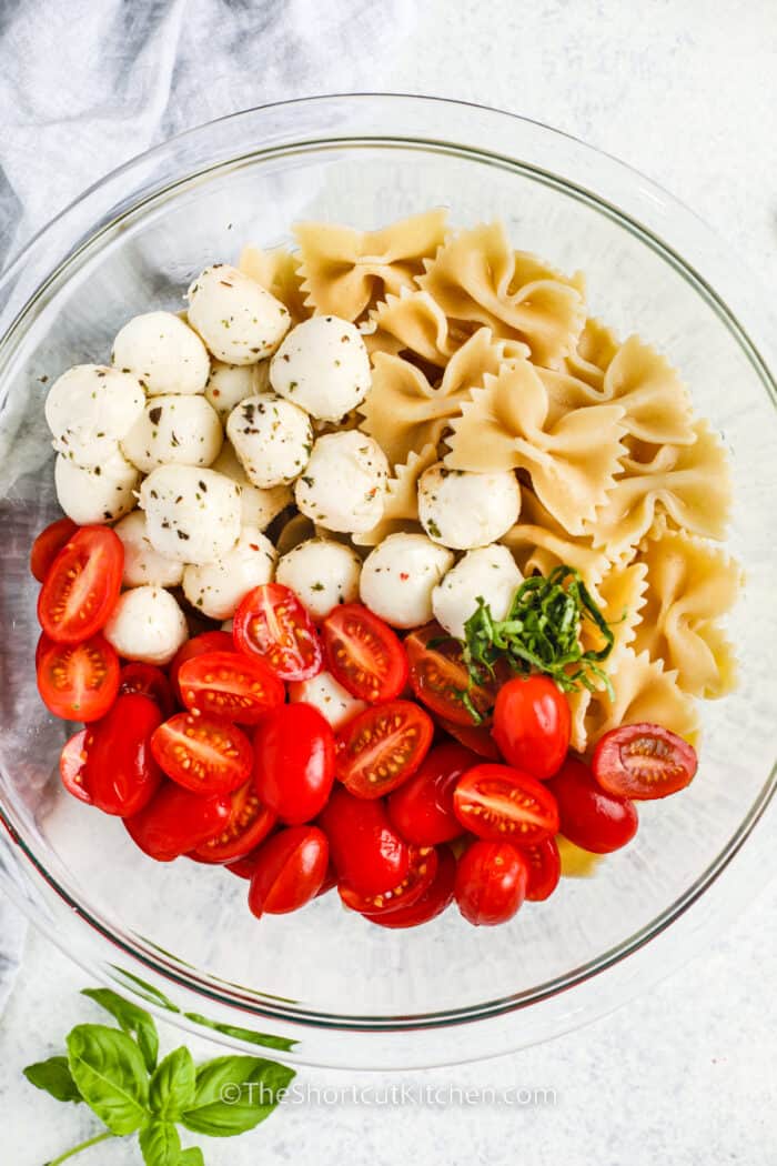 Caprese Pasta Salad ingredients in a bowl