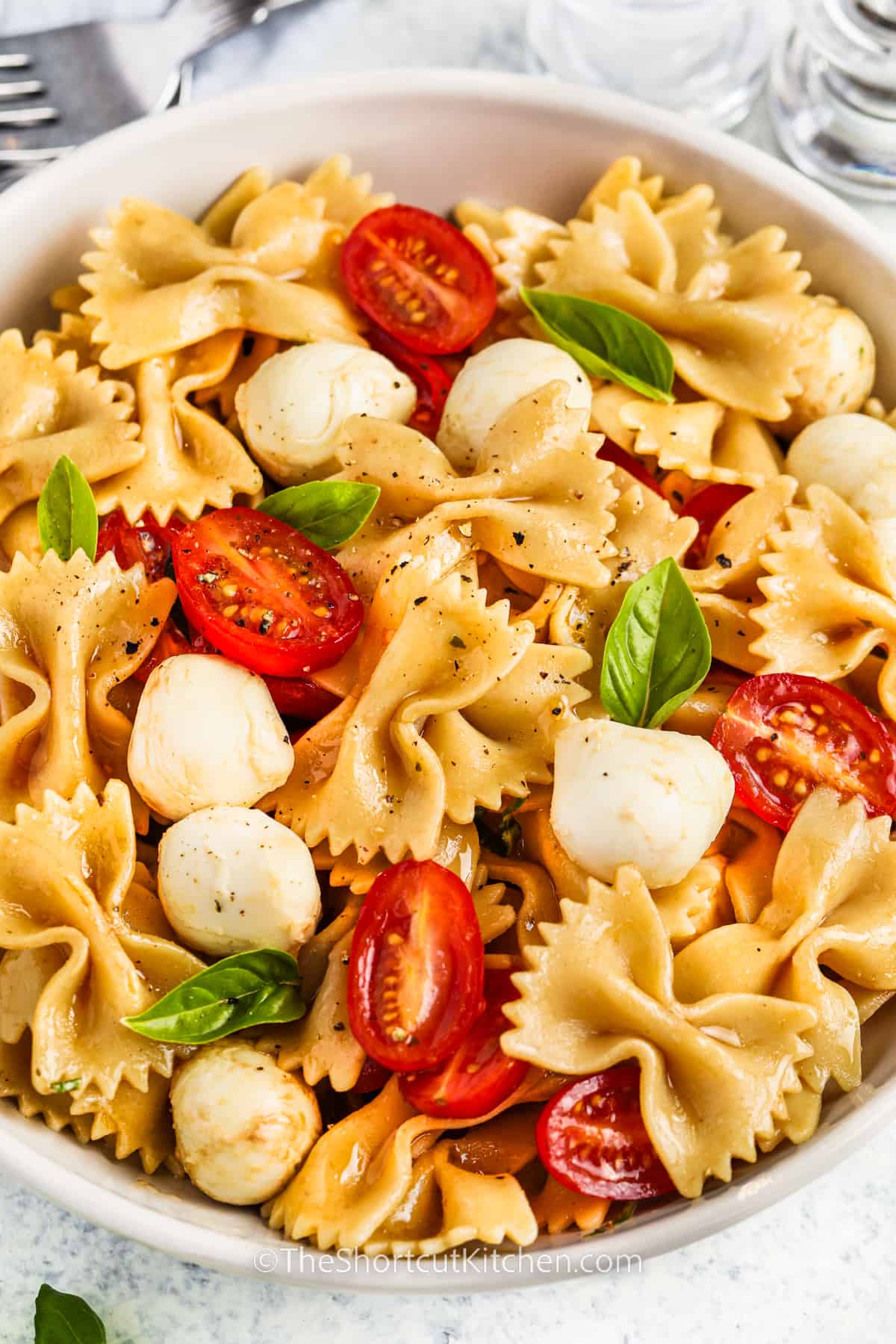 close up of Caprese Pasta Salad in a bowl