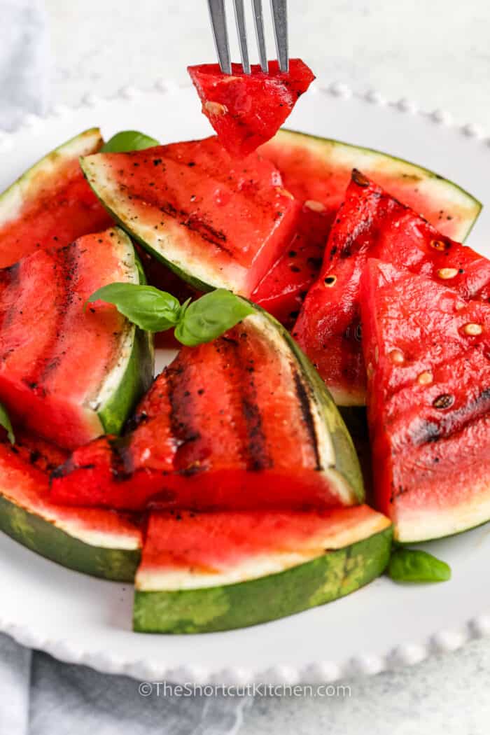 taking a piece of Grilled Watermelon on a fork