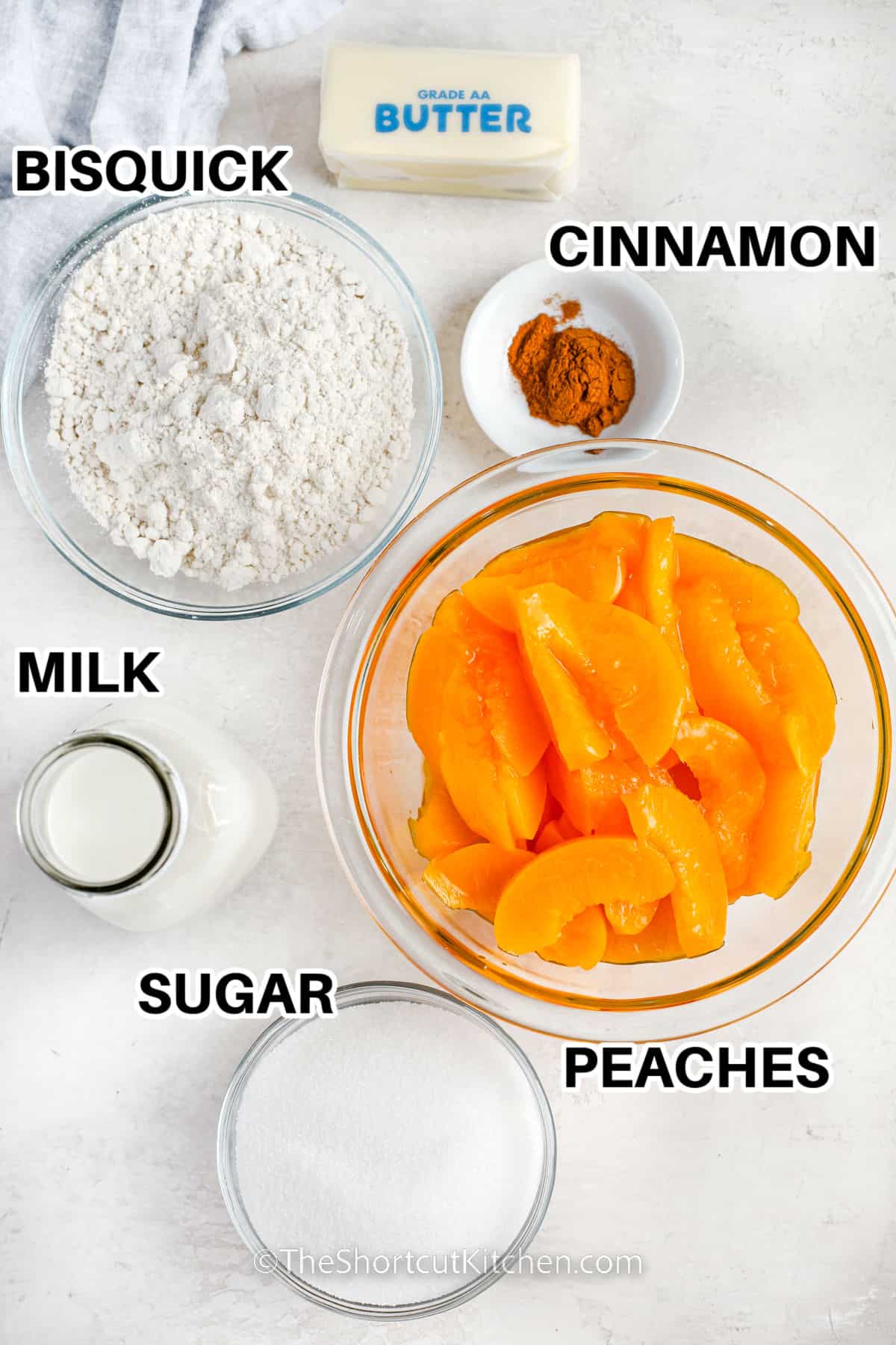 bisquick mix , cinnamon , butter , milk , sugar and peaches with labels to make Bisquick Peach Cobbler Recipe