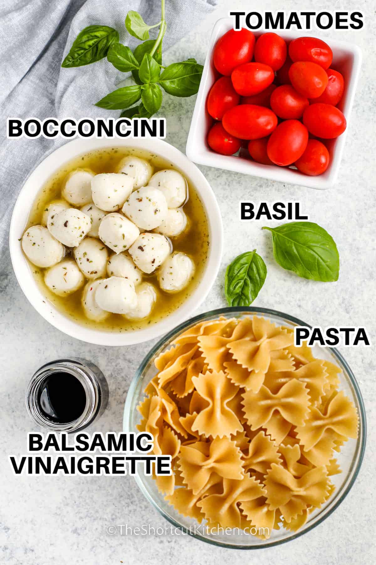 tomatoes , bocconcini , basil , pasta and balsamic vinaigrette with labels to make Caprese Pasta Salad