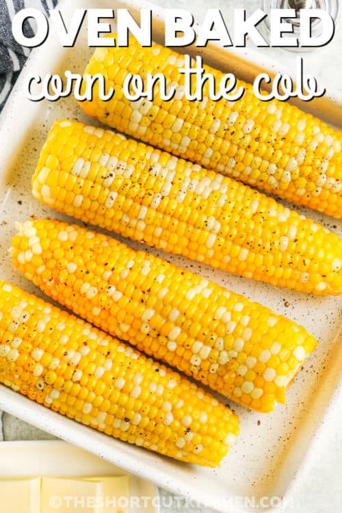 buttery Baked Corn On The Cob on a plate with writing
