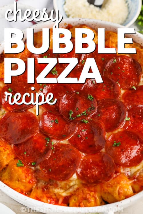 baked Cheesy Bubble Pizza Recipe in the dish with a title