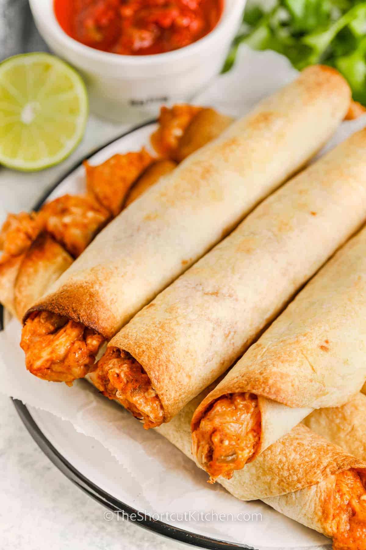 cheese and Chicken Taquitos on a plate