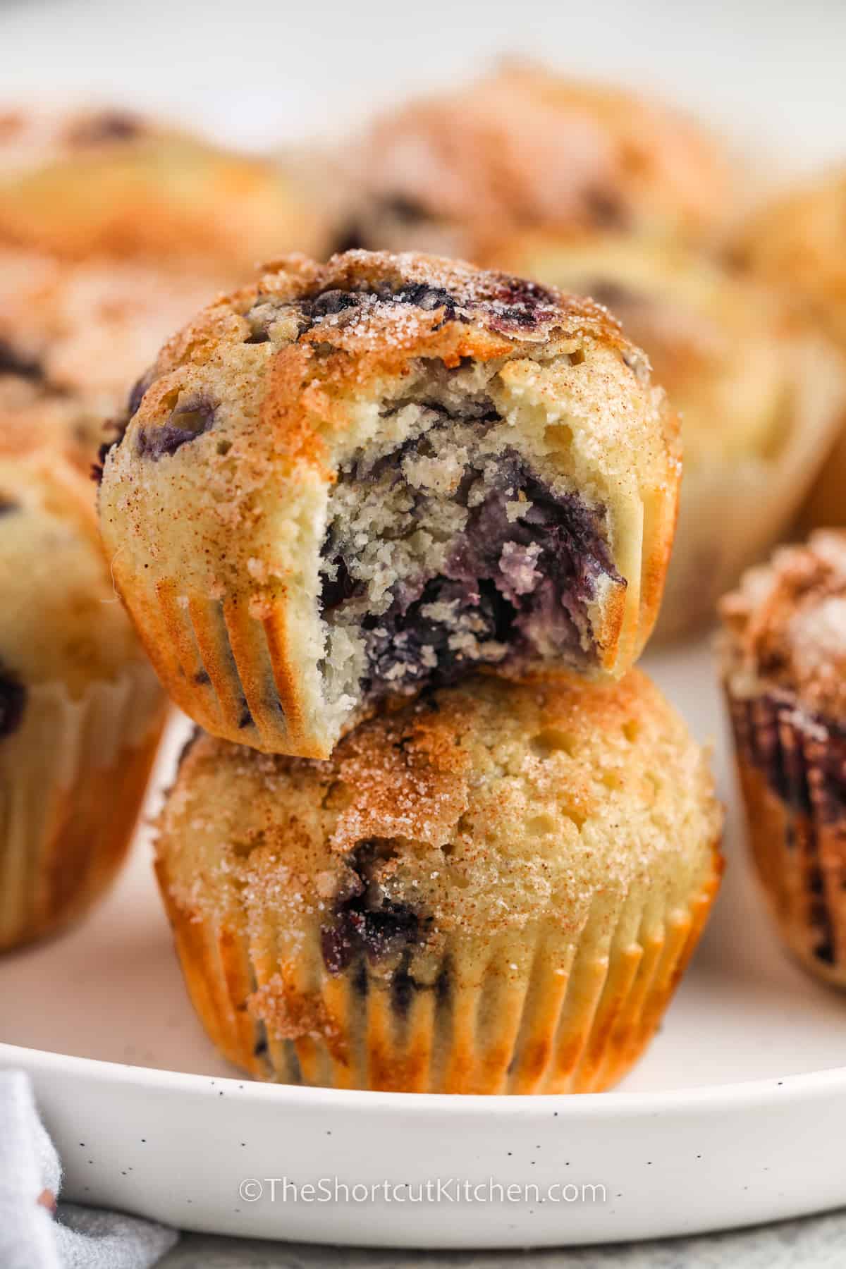 Easy Blueberry Muffins with a bite taken out of one