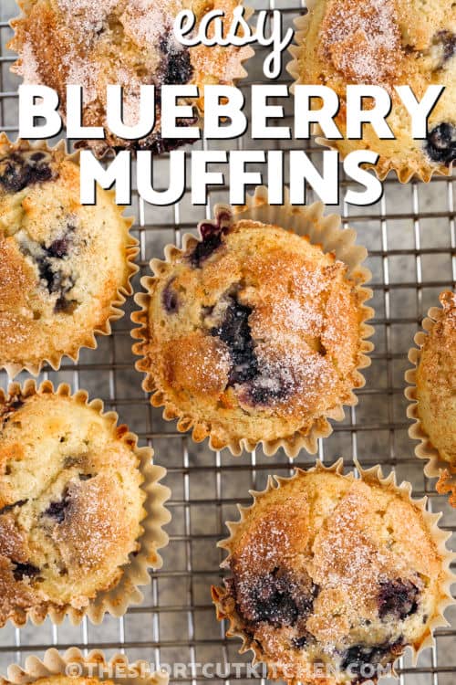 Easy Blueberry Muffins on a cooling rack with a title