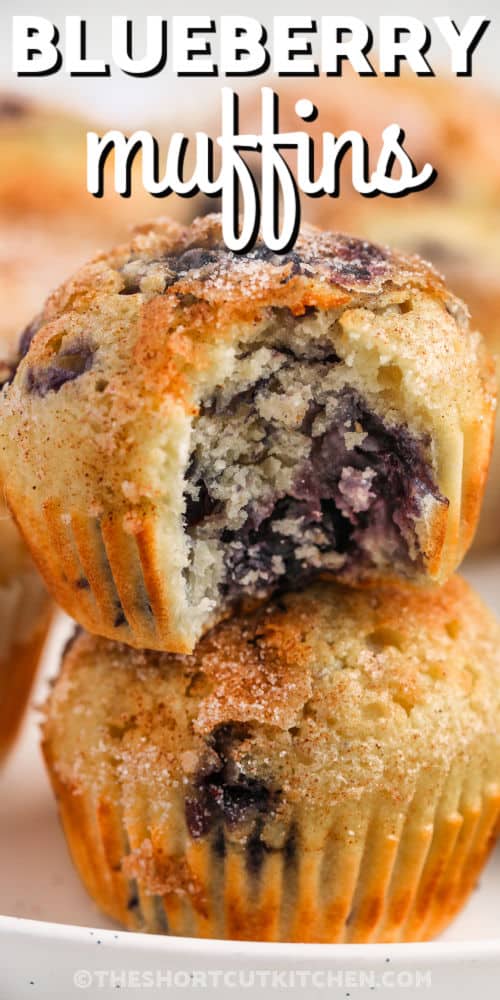 close up of Easy Blueberry Muffins with a bite taken out and writing