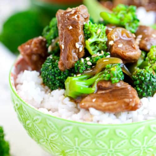 a bowl of rice topped with crockpot beef and broccoli