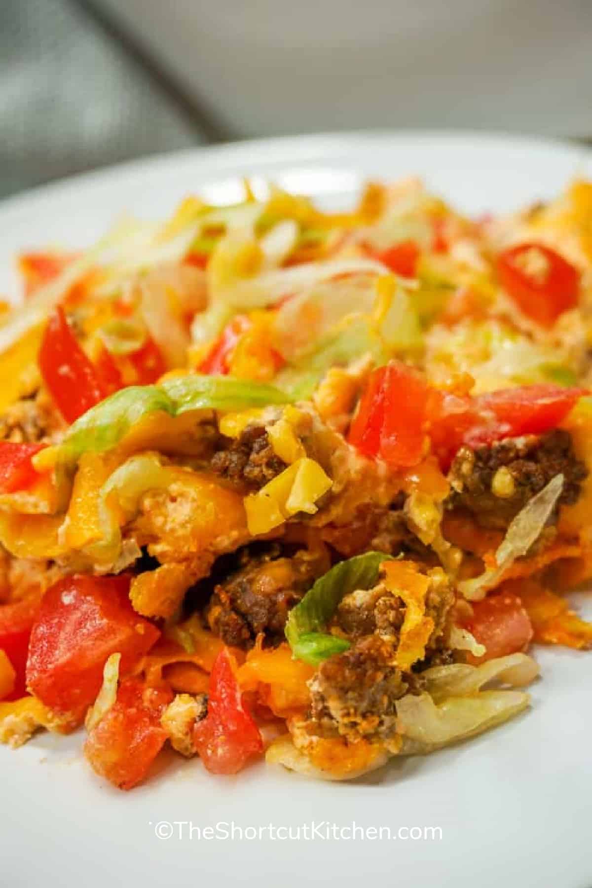 A serving of easy taco casserole on a white plate