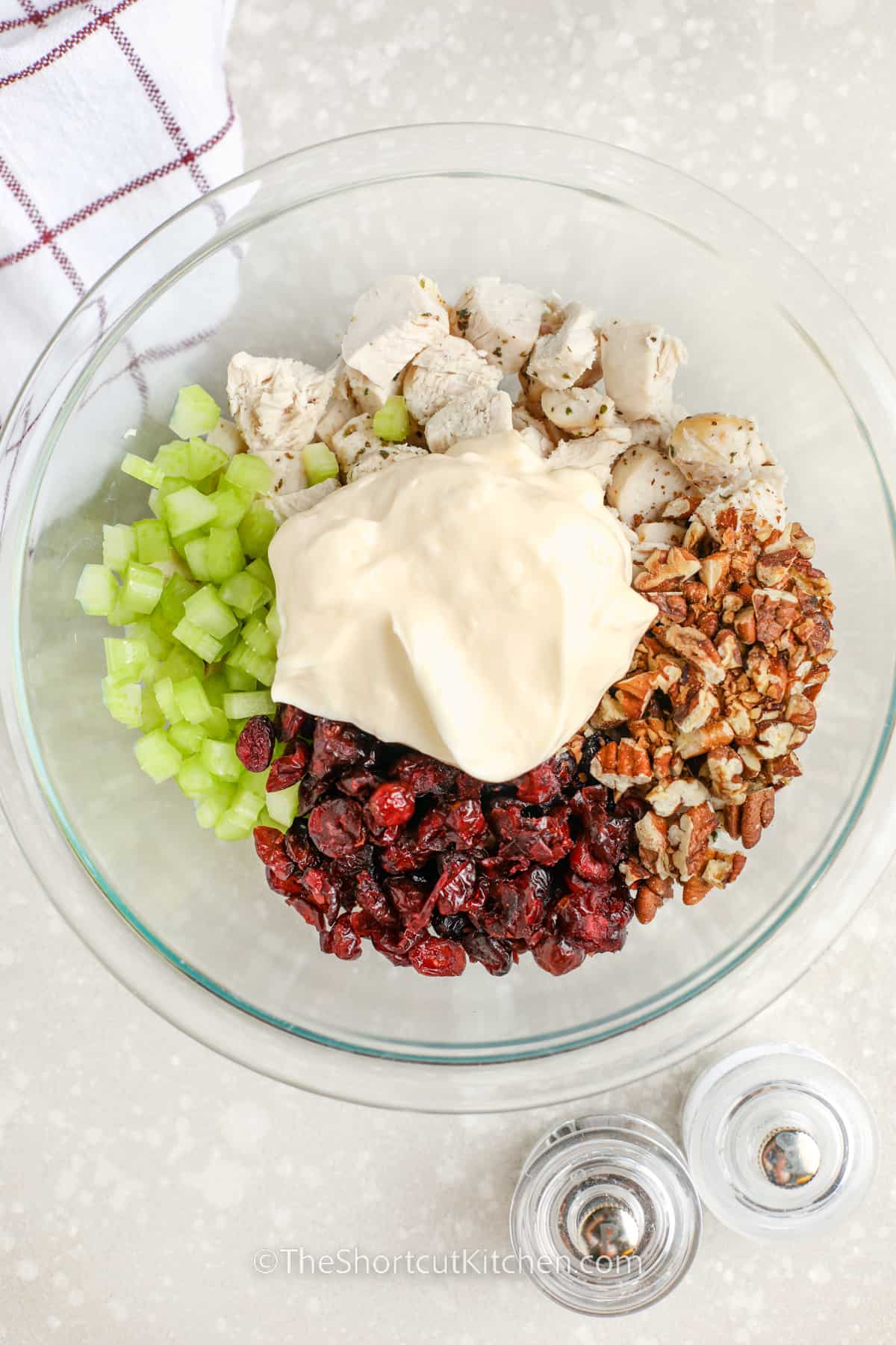 ingredients to make cranberry chicken salad in a bowl to be combined
