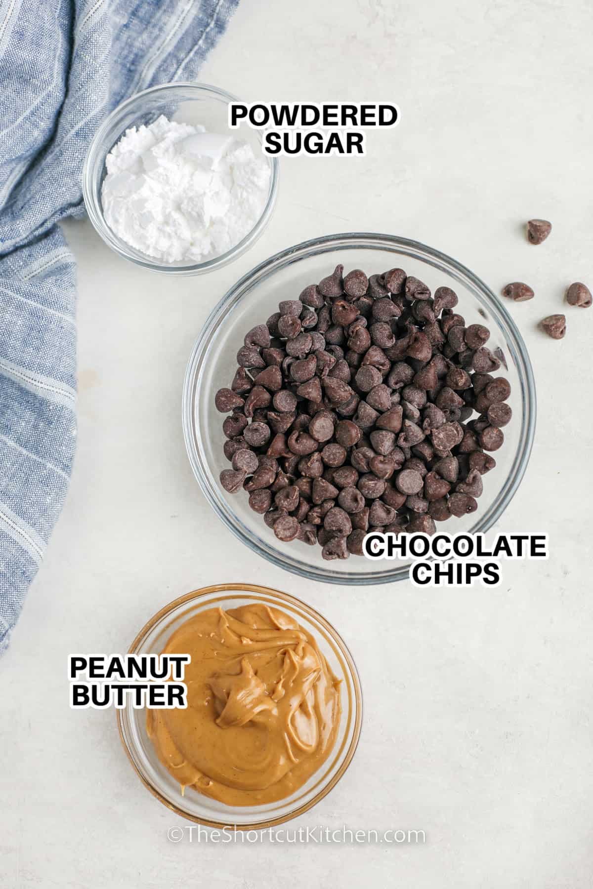 Ingredients to make homemade peanut butter cups labeled: powdered sugar, chocolate chips, peanut butter